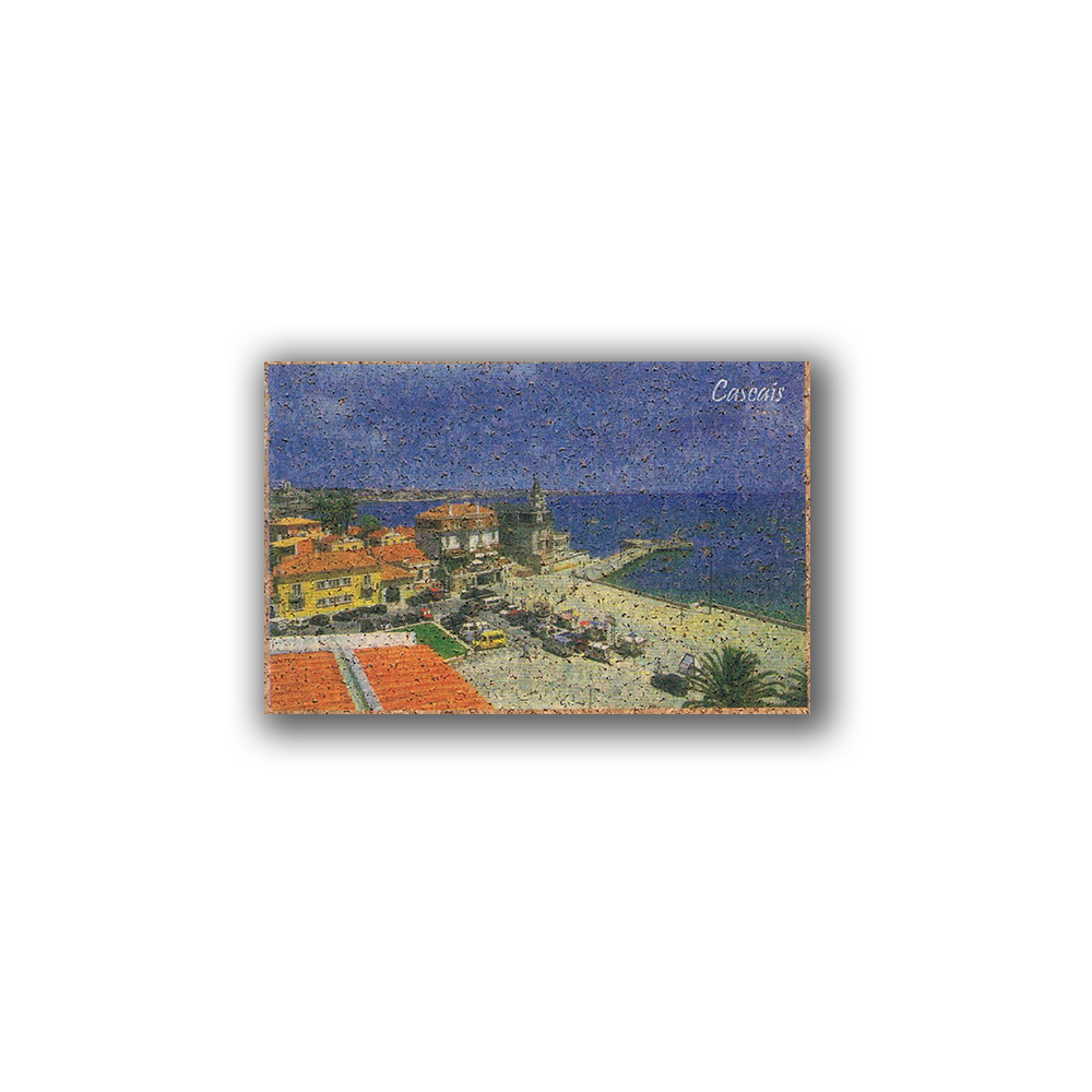 The Cascais - Cork Fridge Magnet by New Jamp features a postcard-style image of Estoril Beach’s sandy shores, vibrant buildings, and church tower—an eco-friendly souvenir from Portugal.