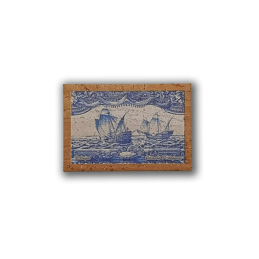 The Navigators Tiles – Cork Fridge Magnet by New Jamp features two old sailing ships in blue ink with waves and clouds. Eco-friendly and evoking Lisbon’s charm, it displays “Portugal” and “Barcos Portugueses” in the lower corners.