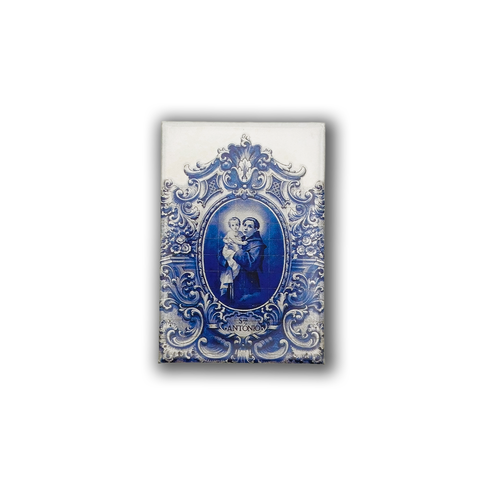 The Saint Antonio - Fridge Magnet by New Jamp features a blue and white ornate ceramic tile design, depicting Saint Anthony holding a child, with "SANTONIO" inscribed—an elegant tribute to Lisbon’s heritage.