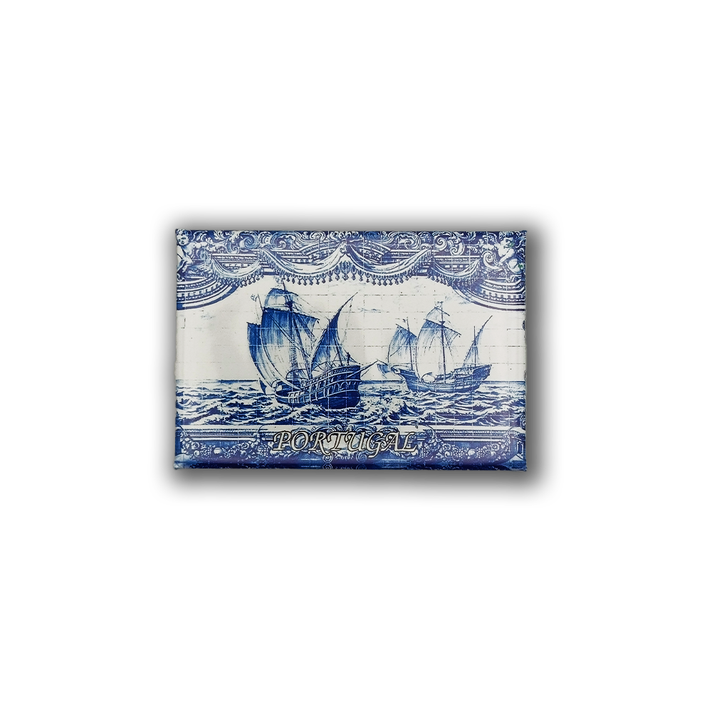 The New Jamp "Discoveries Tile" fridge magnet features blue and white sailing ships, ornate borders, and "PORTUGAL" text—a charming Lisbon keepsake inspired by the Tower of Belém.