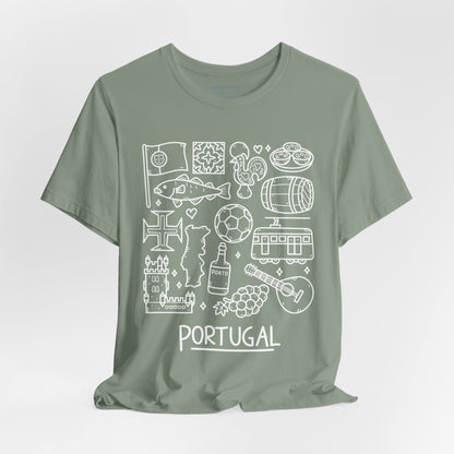 The "Portuguese Doodles Jersey" by Printify is a sage green unisex tee made from soft cotton, featuring intricate white illustrations that represent Portugal. The designs include a soccer ball, tram, wine barrel, guitar, castle, rooster, sardine, and the word "PORTUGAL" at the bottom. Various Portuguese cultural icons and patterns are artistically scattered throughout the fabric.