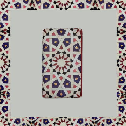Ceuta 1415 – The First Horizon by 100ml is a rectangular tile with a geometric pattern in red, white, blue, and black shapes on gray—evoking Portuguese handcrafted soap and the Age of Discovery fragrance.