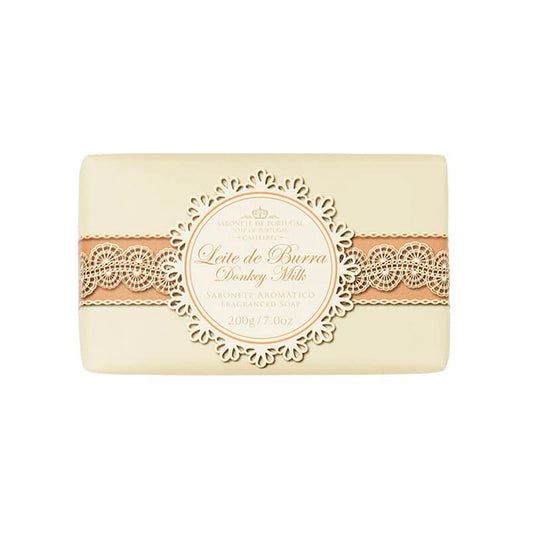 A rectangular bar of handmade soap with a beige and brown ornate label reading "Castelbel Donkey’s Milk Soap 200g" and additional descriptions in smaller text, set against a white background.