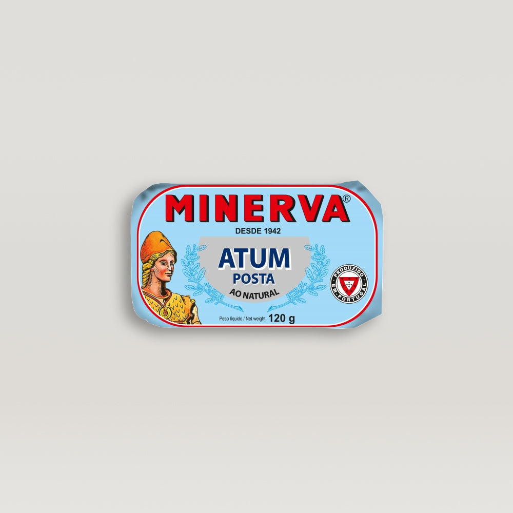 A Minerva solid pack tin of tuna in brine, brimming with flavor, featuring a woman on the label.
