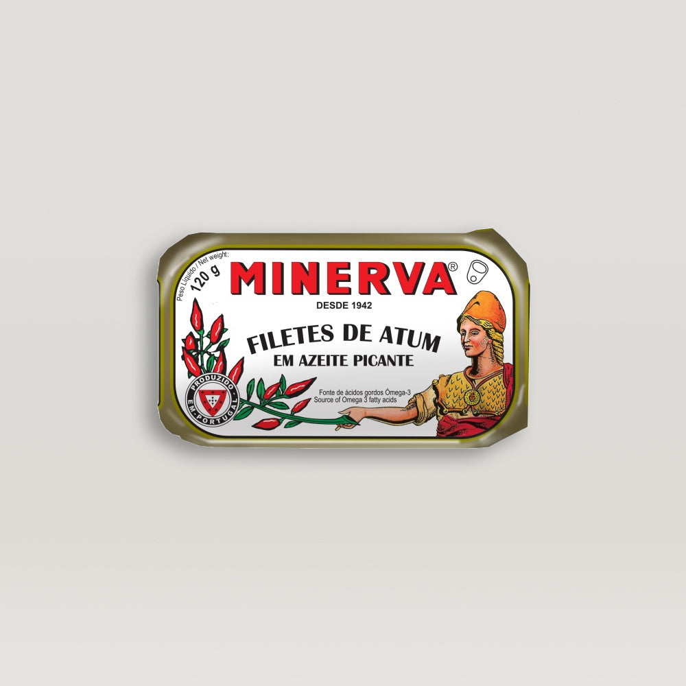 A can of Minerva tuna fillets in spiced olive oil with a woman in a hat.