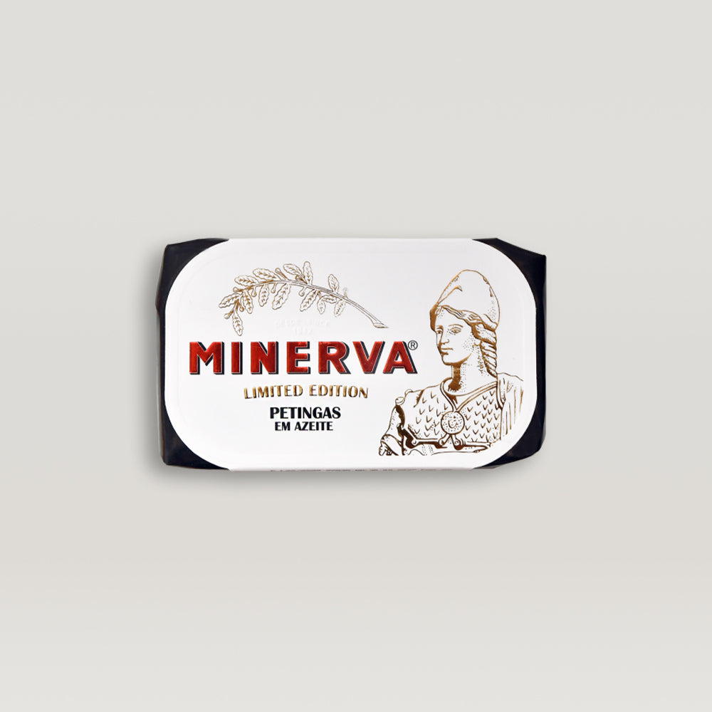 A Portuguese label with the product Petingas in Olive Oil – Limited Edition by the brand Minerva on it.