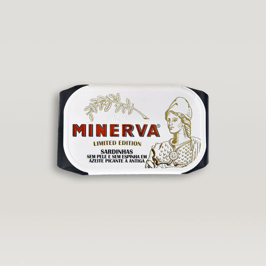 A label with the word Minerva on it featuring skinless and boneless sardines in spicy olive oil and pickles.