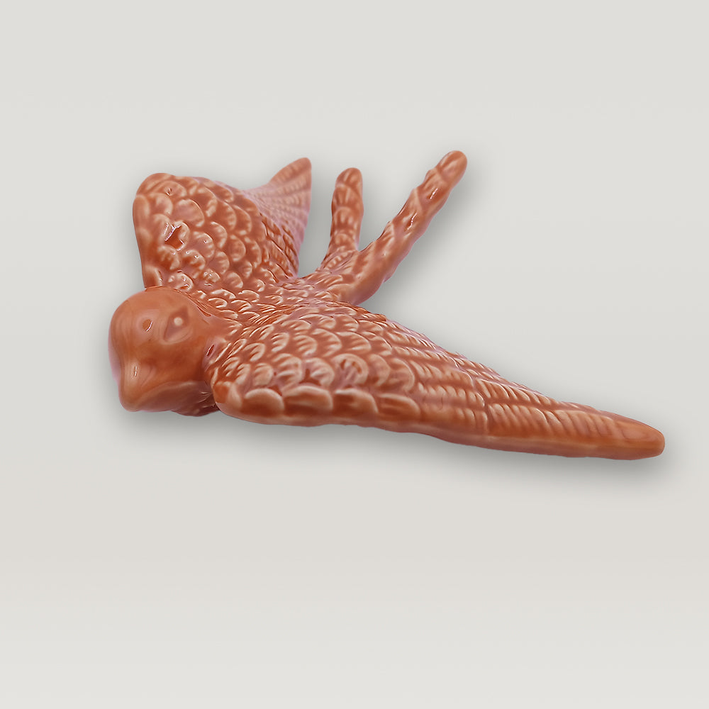 A small Tejo Shop Portuguese Ceramic Swallow figurine is shown on a white background.