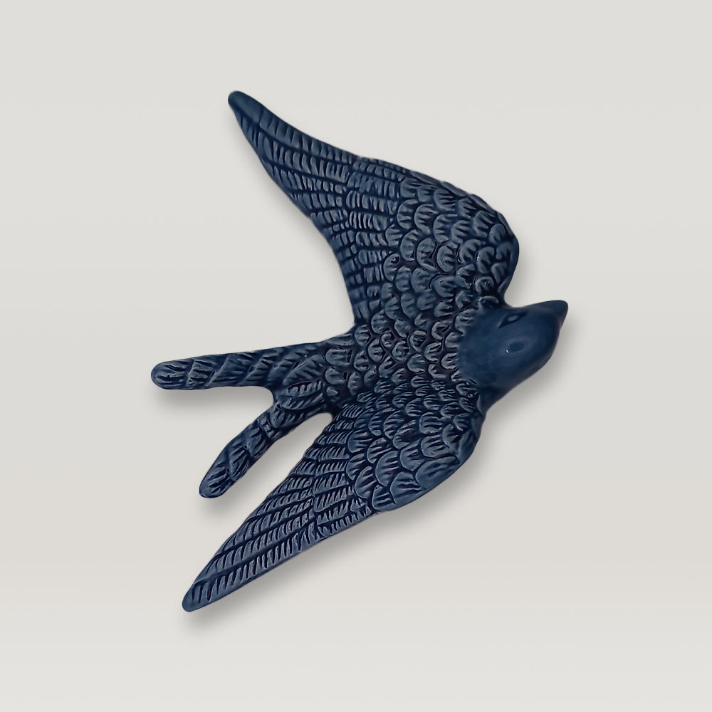 A luxurious addition - Tejo Shop's Portuguese Ceramic Swallow - on a white background.