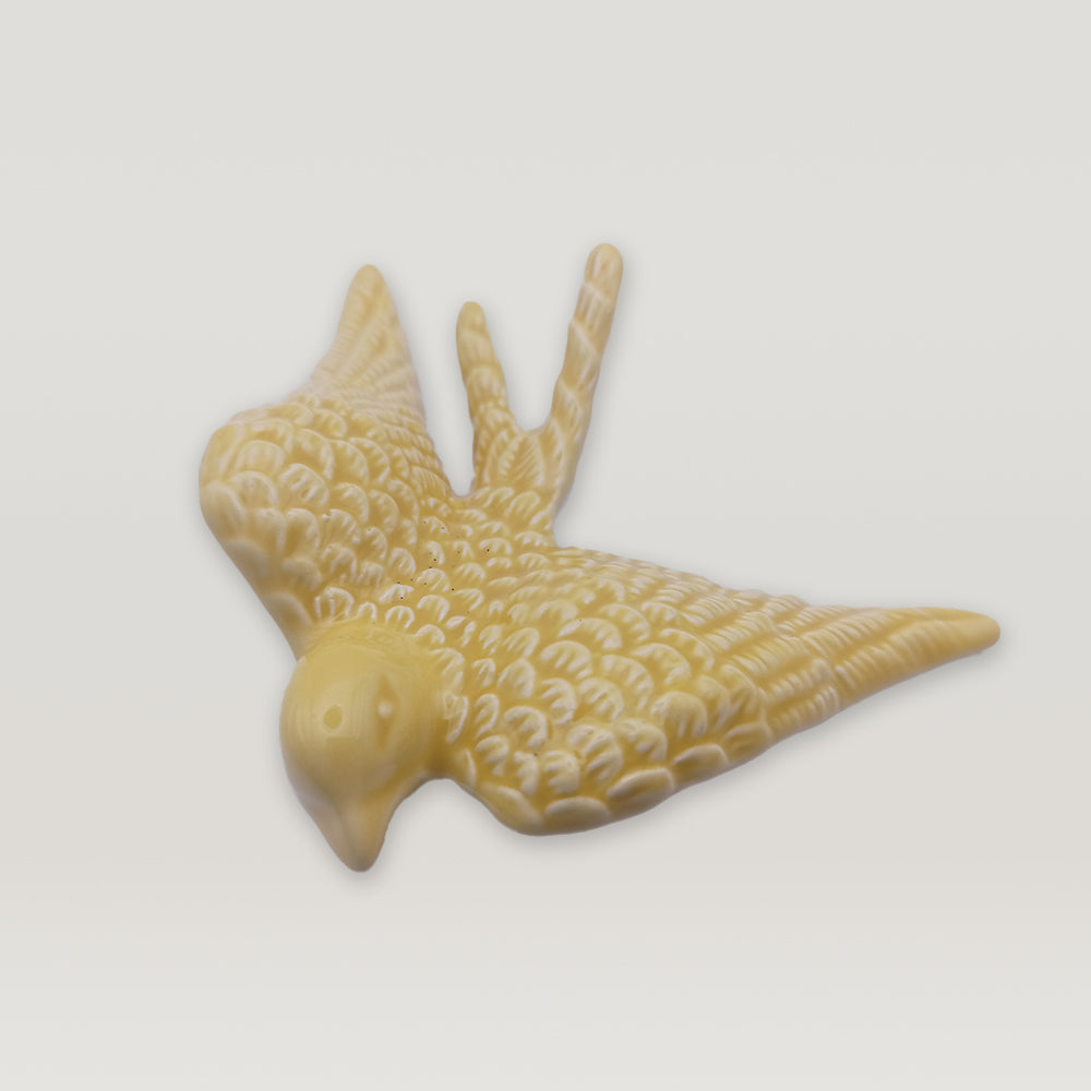 A luxurious addition, Tejo Shop's Portuguese Ceramic Swallow figurine on a white background.