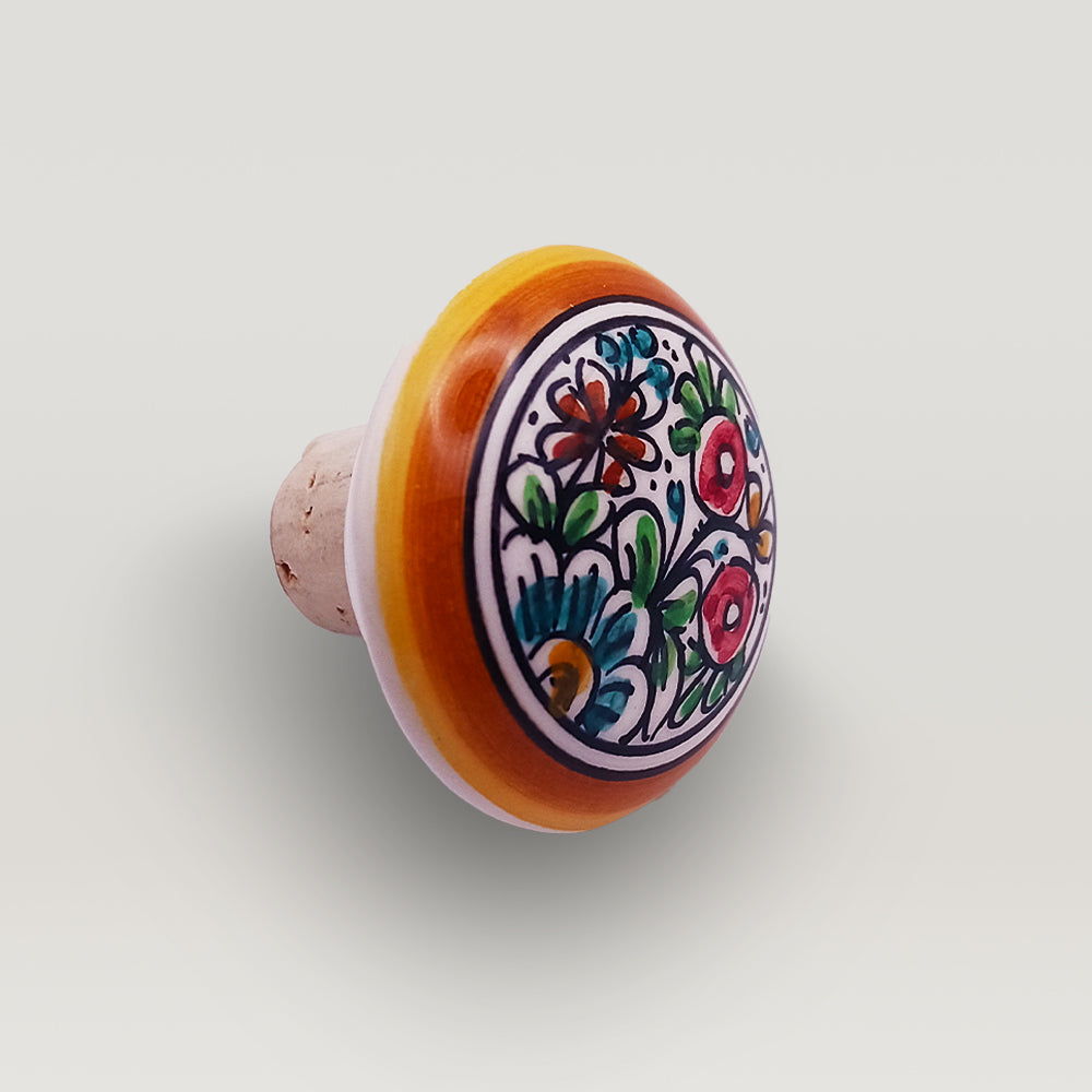 Handcrafted ceramic decorative Wine bottle stopper with floral pattern on a white background by Tejo Shop.