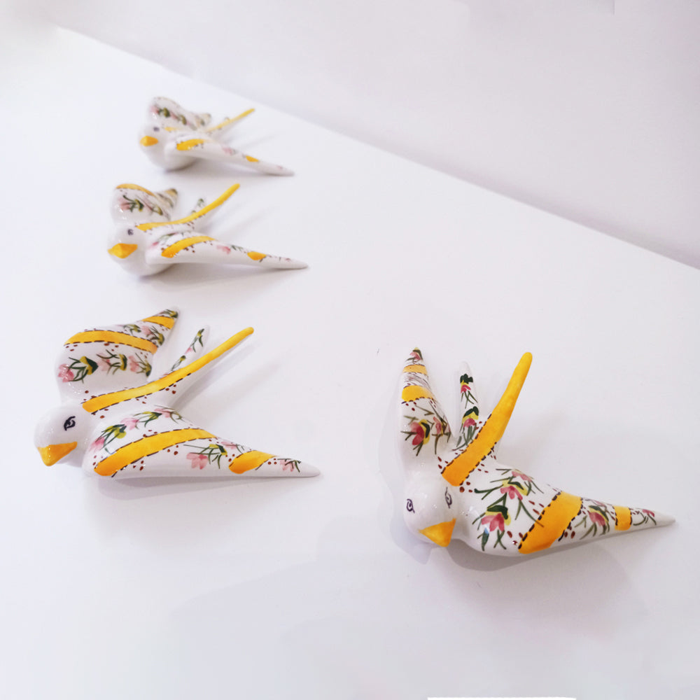 Portuguese ceramic swallow, handpainted with yellow striped and flowers.