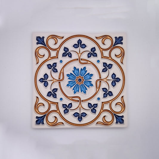 A Lisbon Hand Painted Tile featuring a detailed floral and scroll design in blue, white, and tan colors, with a prominent blue flower at the center by Tejo Shop.