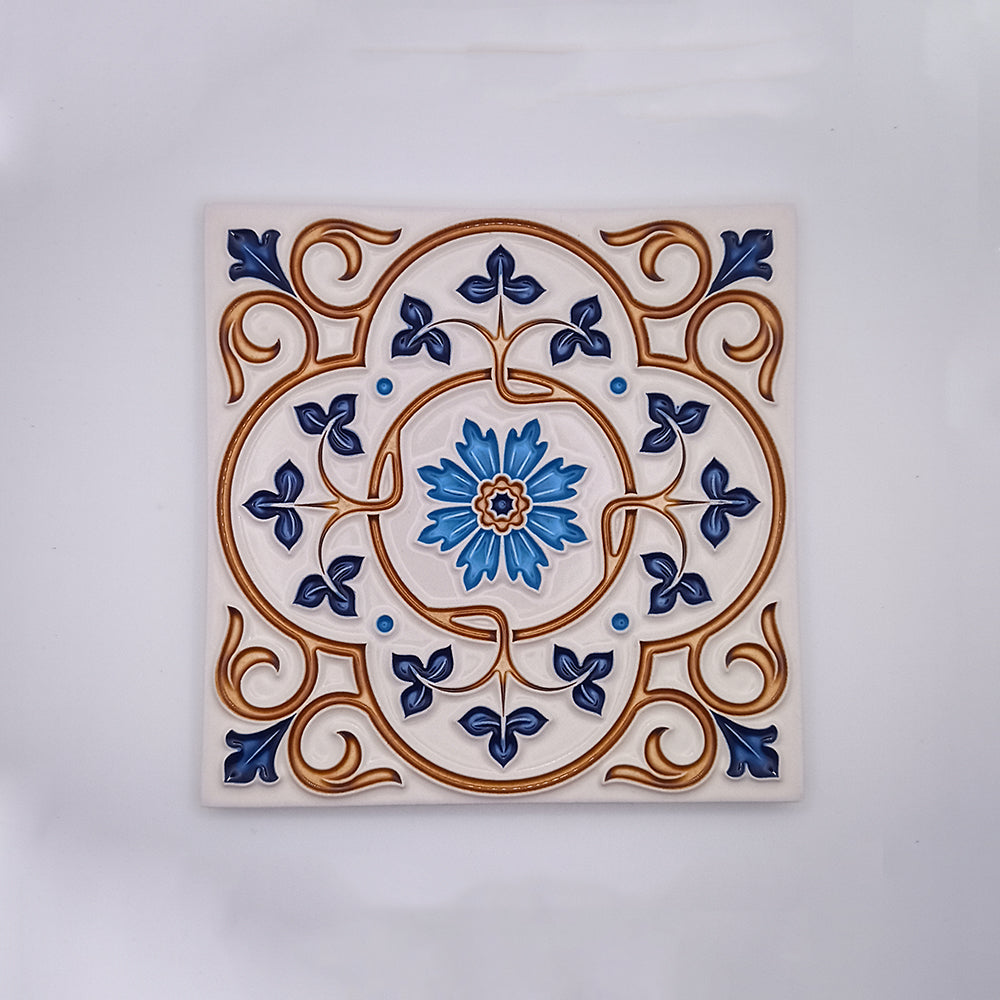 A Lisbon Hand Painted Tile featuring a detailed floral and scroll design in blue, white, and tan colors, with a prominent blue flower at the center by Tejo Shop.