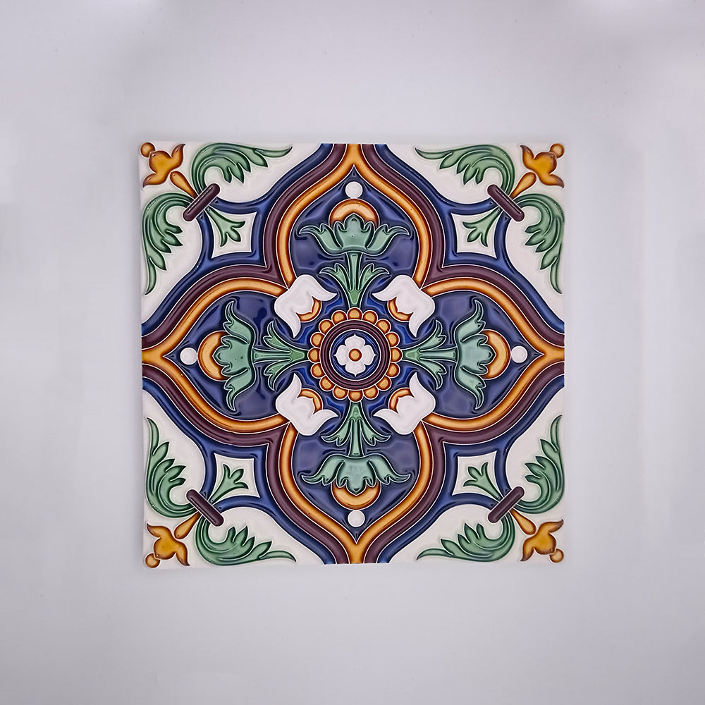Intricately painted Tejo Shop Sagres Home and Decor Tile showcasing a symmetrical floral design in vibrant blue, green, orange, and white colors with a detailed border on a white background.
