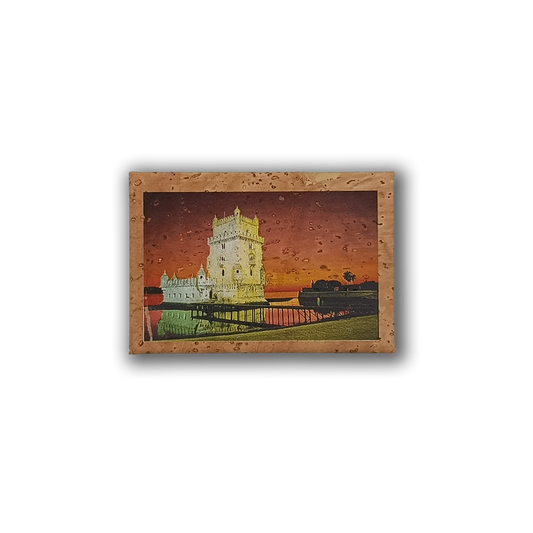 The New Jamp "Tower of Belem - Cork Fridge Magnet" features a framed illustration of the historic Portuguese tower by the water at sunset, set against an orange-red sky with tree silhouettes on the right.