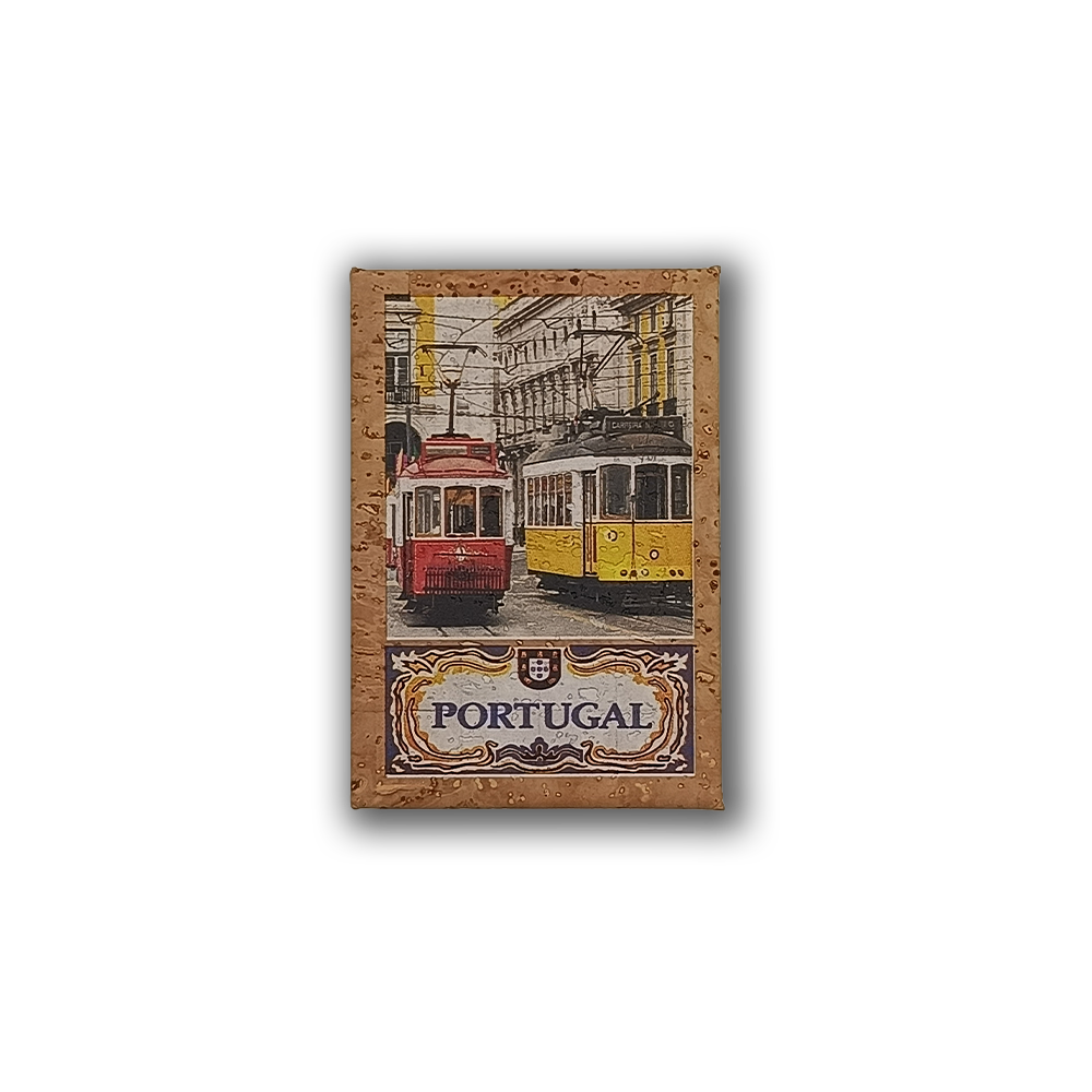 A cork fridge magnet by New Jamp, "Trams Pair," featuring red and yellow trams on a Lisbon street with the Rua Augusta Arch in the background and “Portugal” in ornate lettering.