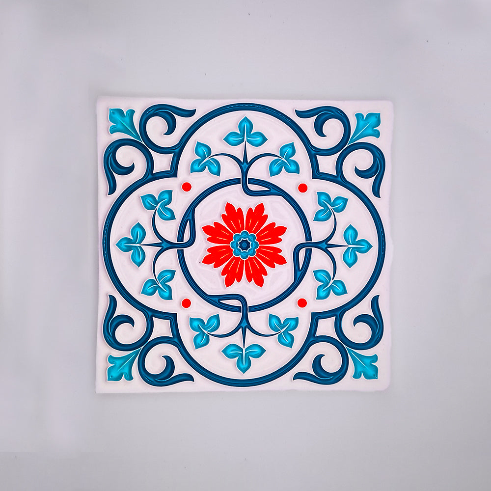 A decorative hand-painted Moroccan Tile from Tejo Shop featuring a central red flower surrounded by blue and turquoise floral patterns and swirls on a white background.