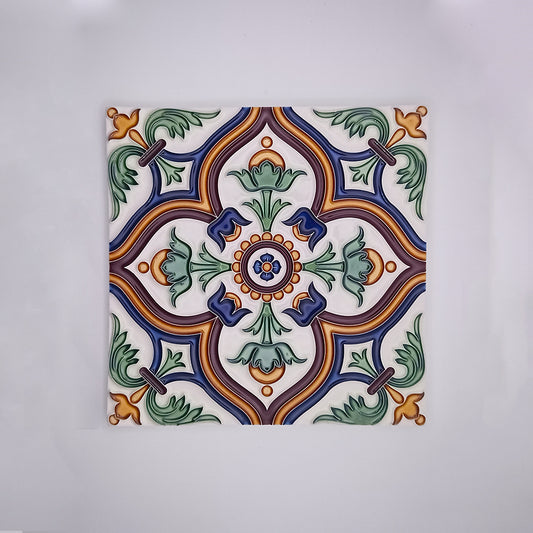 Decorative Albufeira Porcelain Tile with a symmetrical pattern featuring a green and blue floral design surrounded by orange accents, displayed against a white background, capturing the Portuguese charm. Sold by Tejo Shop.