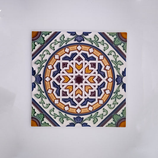 Decorative handcrafted painted ceramic tile featuring intricate geometric and floral designs in blue, green, orange, and white colors, centered on a symmetrical pattern, displayed on a plain background from Azores Tiles and Decor by Tejo Shop.