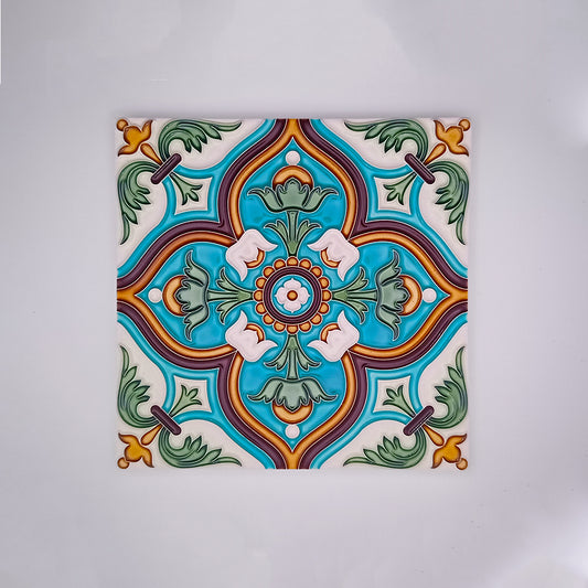 Decorative hand-painted Traditional Spanish Tile featuring a symmetrical pattern with vibrant blue, green, and red colors, accented with white and orange details on a square tile by Tejo Shop.