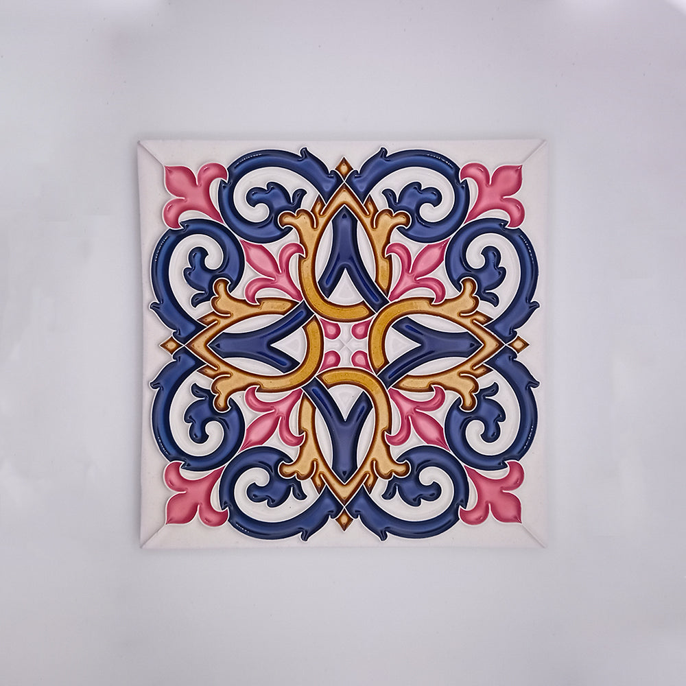 Decorative hand-painted Tejo Shop Porto Wall Tiles Decor with a vibrant, symmetrical floral pattern featuring bold shades of blue, pink, and gold on a white background.